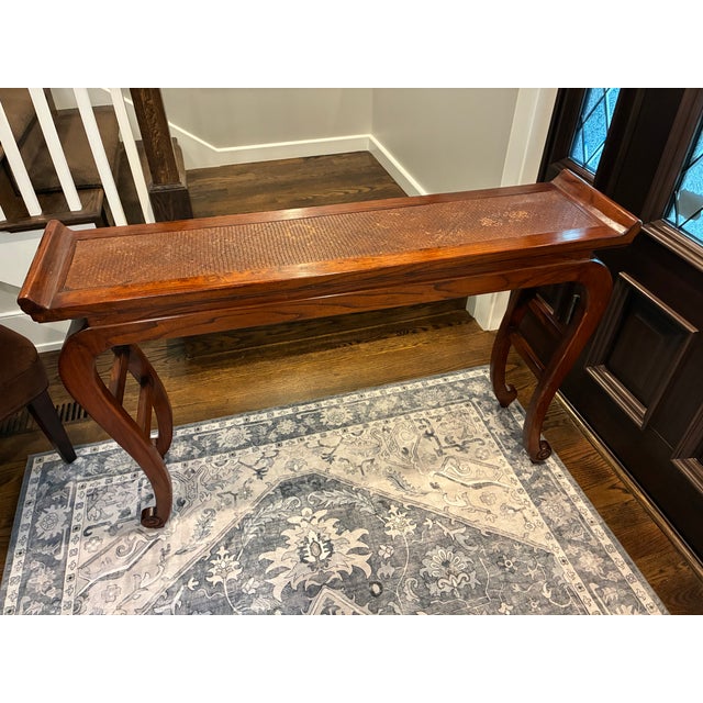 A mid-to-late 20th century vintage reproduction (1950s–1990s), Baker Furniture- style with a rich mahogany tone, solid...