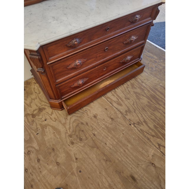 Late 19th Century Victorian Walnut Marble Top Dresser with Carved Pulls