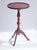 An antique Folk Art wine table made in the Netherlands. The plant stand is painted in red with floral details. The...