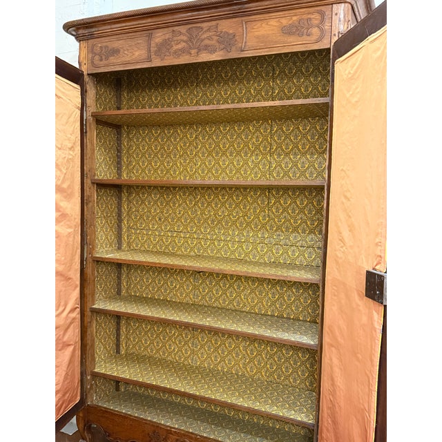 Design Plus Gallery presents a 19th Century French Provincial Louis XV Armoire. Constructed from solid woods with a...