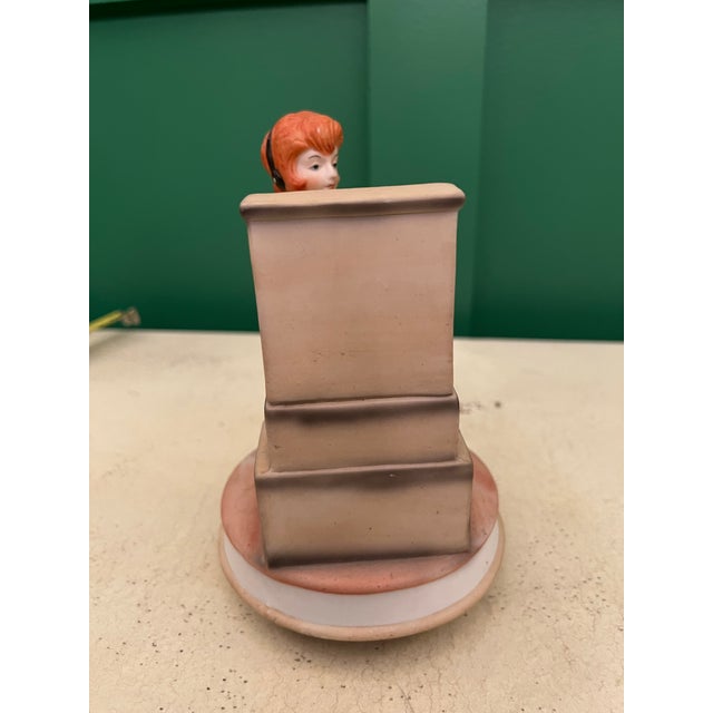 Very rare music box depicting a telephone operator sitting at her switchboard. It plays the tune "Try to Remember" from...