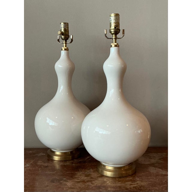 Presenting a magnificent pair of vintage Visual Comfort "Addison" lamps, embodying the elegant and glamorous aesthetic of...