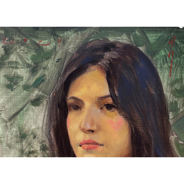 This portrait captures a young Mexican girl with a serene expression, her gaze directed thoughtfully outward. The vibrant...