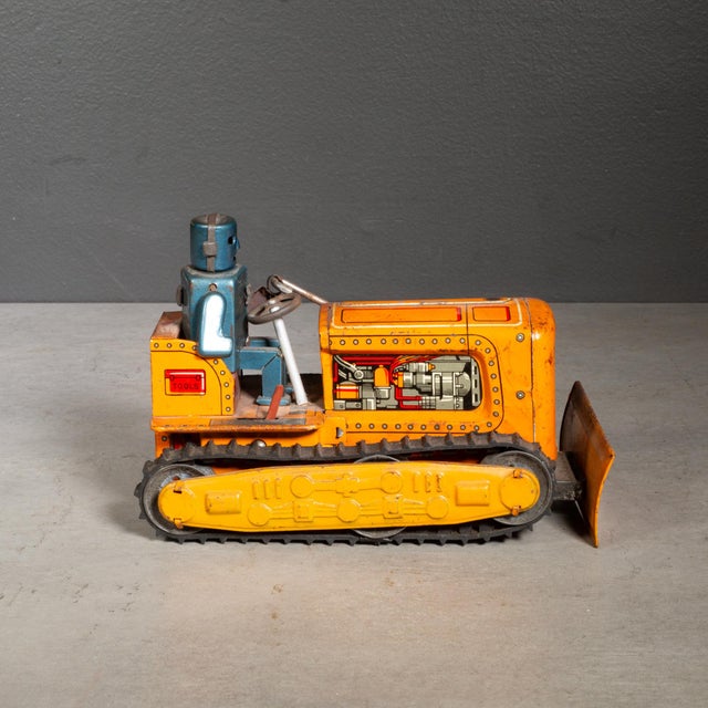 ABOUT Tin robot bulldozer in orange from KO Yoshiya, Japan. Hard to find model with rubber treads and vivid lithographic...