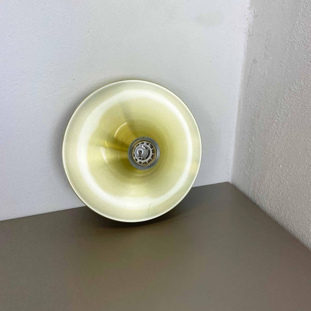 Original 1970s modernist german wall light made of solid metal aluminum. This item was produced by honsel lights in the...