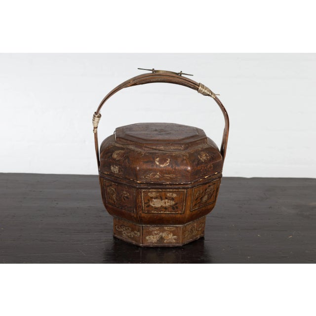 A Chinese late Qing Dynasty period antique lacquered octagonal basket from the early 20th century with hand painted floral...