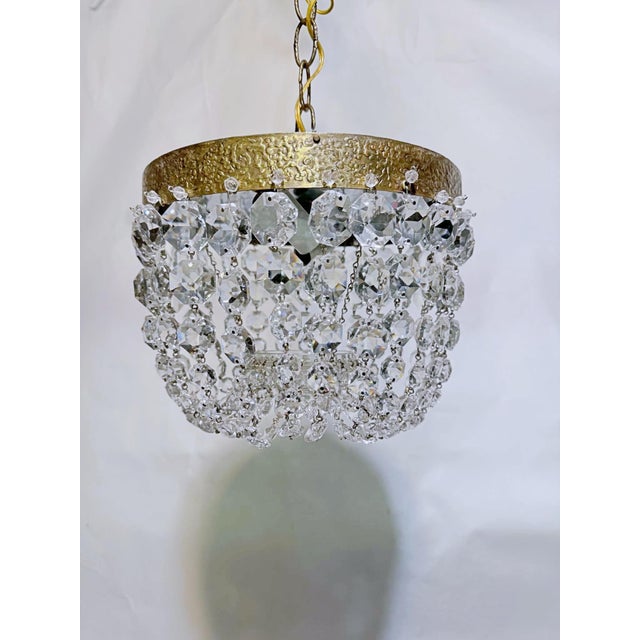 Bring effortless vintage sophistication to your space with this stunning mid-century tiered brass crystal basket...