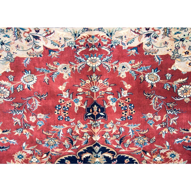 A wonderful late 20th century Indian Tabriz-style rug with a large central complex medallion woven with myriad stylized...