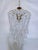 Parachute chandelier with brass wired dome, octagon chain, graduated chain and 30% leaded U-drop crystals. It has an...
