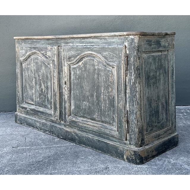 This exceptional 19th-century French Provincial sideboard captures the effortless charm of country manor living. Crafted...