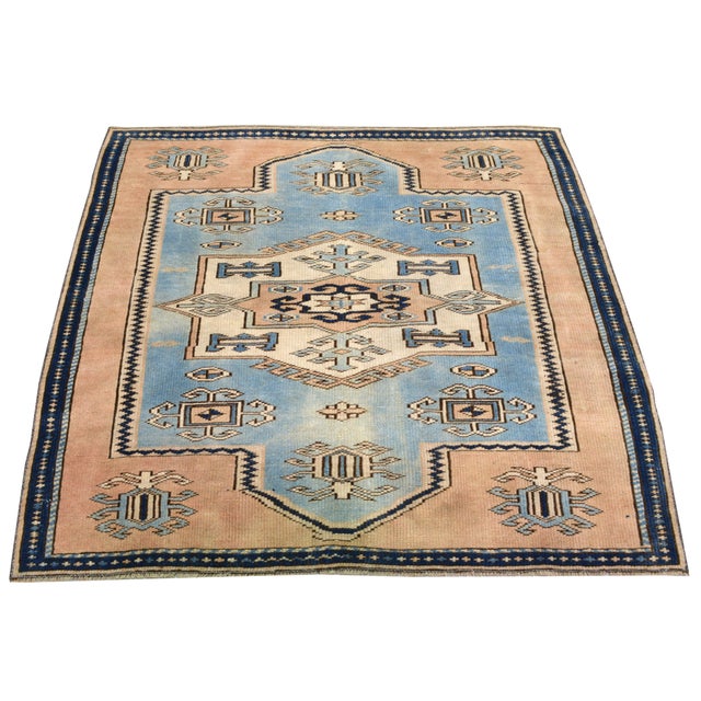 Hand-knotted with care using traditional rug making techniques, this wool rug blends timeless craftsmanship with a modern...