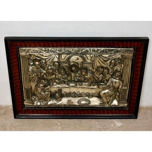 Decorative framed relief depicting The Last Supper, one of the most iconic scenes in Christian art. Richly detailed, the...