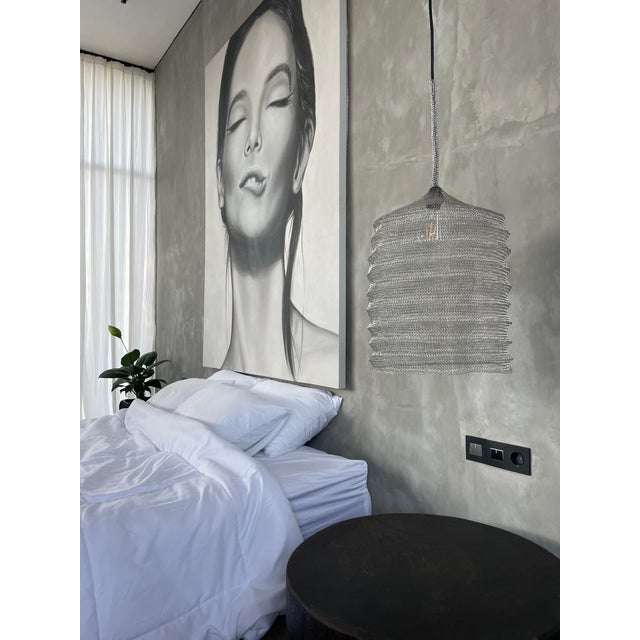 A bewitching minimalistic handcrafted knitted lamp for a stylish interior. The product is handmade from stainless wire...