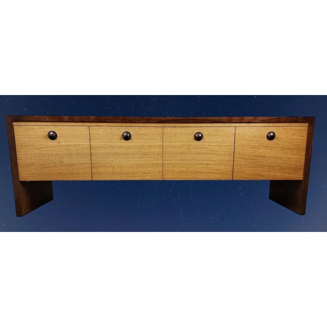 Rare 1940's Edward Wormley for Dunbar credenza with rosewood sled based open bottom casement. Four large file sized...