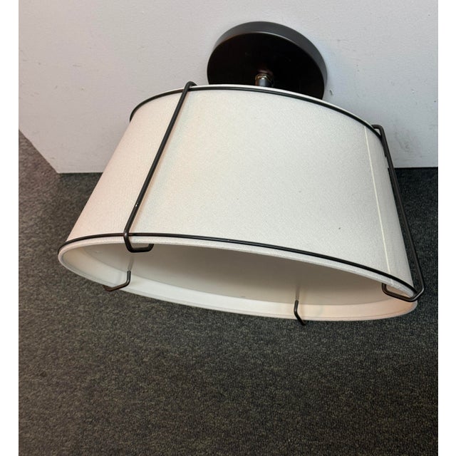 Design Plus Gallery presents a Conical Flush Mount Fixture from Rejuvenation. Lofty lines and linen shade adds a casual,...