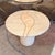 A beautiful vintage tessellated travertine side table with tessellated coral inlay and brass trim detailing. A beautiful...