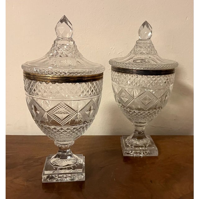 Pair antique 19th century George III Anglo Irish cut crystal chestnut urns and covers. Profusely cut with solid stepped...