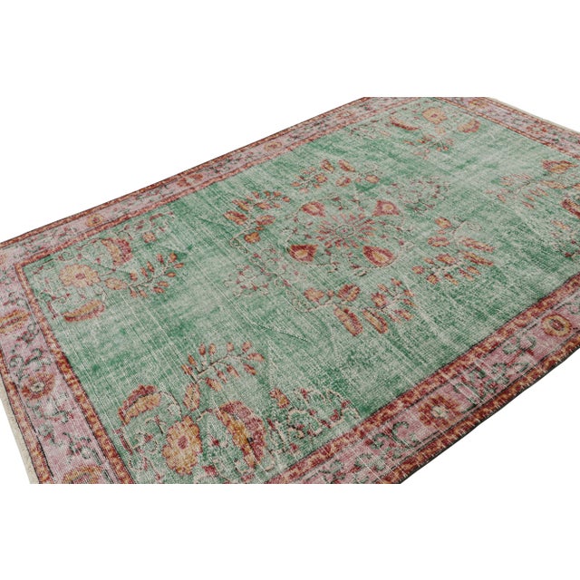 Hand Knotted in wool, this 6x9 vintage Zeki Múren rug originating from Turkey, circa 1960-1970, features geometric...