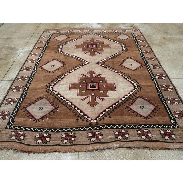 A vintage Turkish Anatolian tribal room size carpet handmade during the mid-20th century. Measures: 9' 0" x 11' 7"