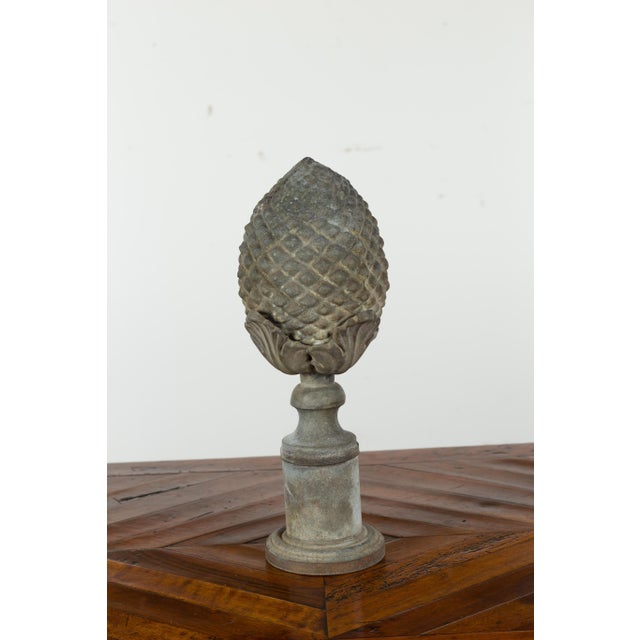 A French zinc pinecone fragment from the early 20th century, with acanthus leaves and tall circular base. Created in...