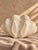Charming vintage set of three sculptural ceramic seashell dishes featuring glossy blush pink interiors and beautifully...