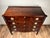 A handsome mid-19th century Sheraton cookie-corner four drawer chest in mahogany, showing the lingering classical...