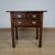 A george ii oak side table. Two short and one long drawer with original brass handles. Solid walnut and elm with a solid...
