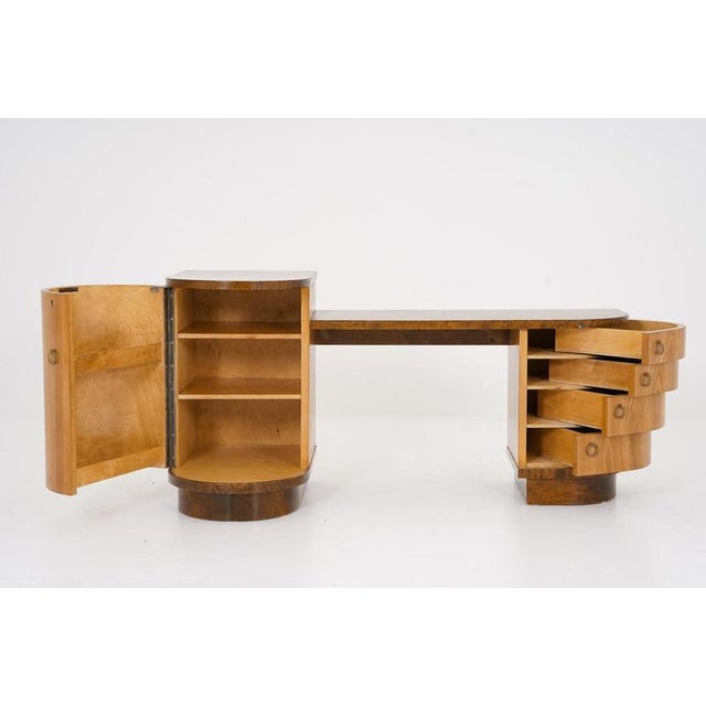 Beautiful hallway console by Axel Larsson for Bodafors, Sweden. This console offers one locker and four drawers that...