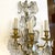 French Pair 1920s Large French Louis XV Style Gilt Brass and Crystal Three-Light Wall Sconces For Sale - Image 3 of 9