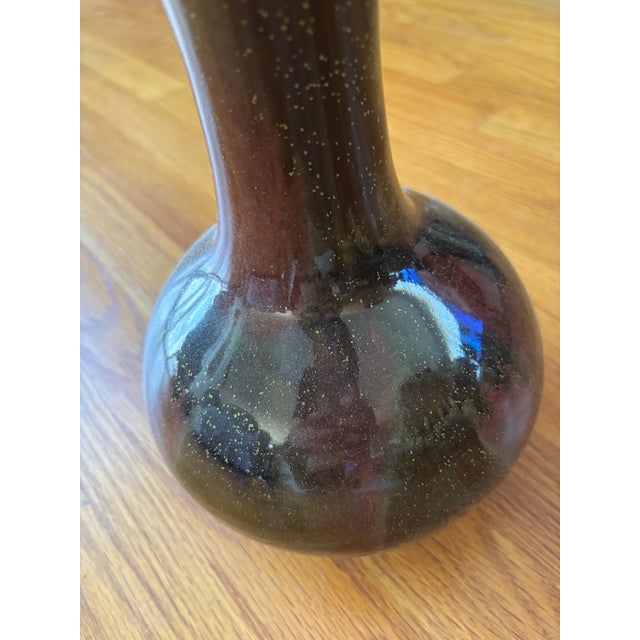 An authentic antique Chinese Sang de Boeuf (Oxblood) porcelain bottle vase, featuring a rich, deeply saturated red glaze...