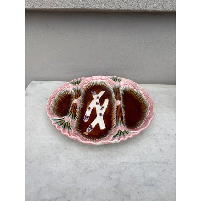 Unusual French Majolica asparagus plate with 3 spaces unsigned, circa 1890.