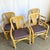 Add a touch of relaxed elegance to your dining space with this set of four boho chic rattan armchairs. Featuring...