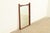 A beautiful Mid-Century Modern sculpted walnut and rosewood framed wall mirror In the manner of Broyhill Brasilia By Kent...