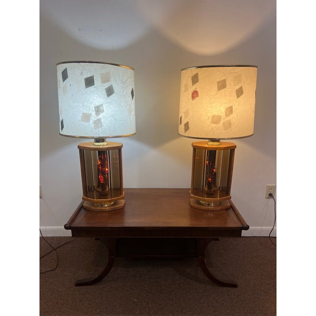 These are the quintessential Mid-Century Modern oak lamp set with etched amber glass bases with flikering candle like...