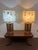 These are the quintessential Mid-Century Modern oak lamp set with etched amber glass bases with flikering candle like...