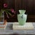 Vintage Italian Scavo vase in a beautiful fluted shape from the 1960s. Made of frosted green glass with three blue glass...