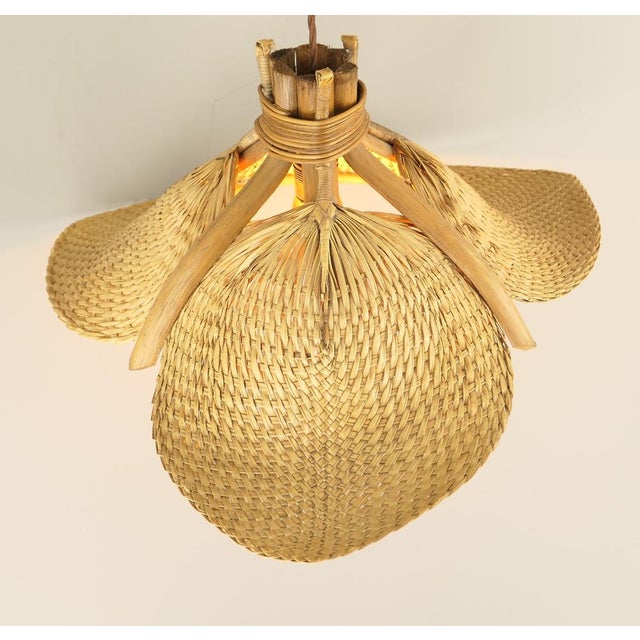 The lamp consists of three woven compartments attached to a bamboo frame. When the lamp is lit, it emits a beautiful, warm...