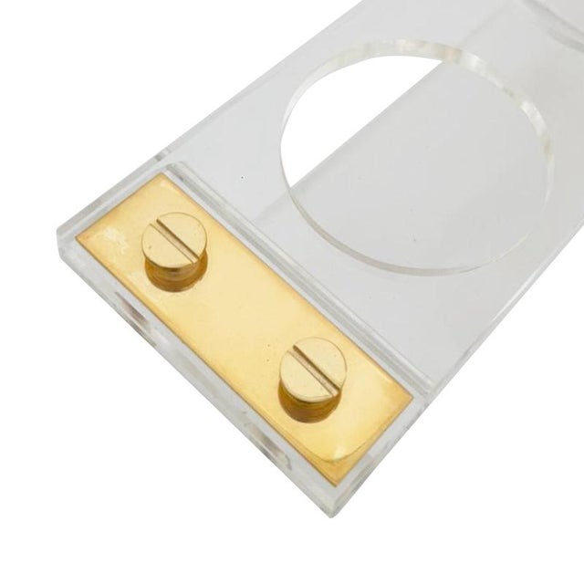 Elegant Italian wine bottle holder from the 1970s, crafted in clear acrylic (methacrylate) combined with metal details....