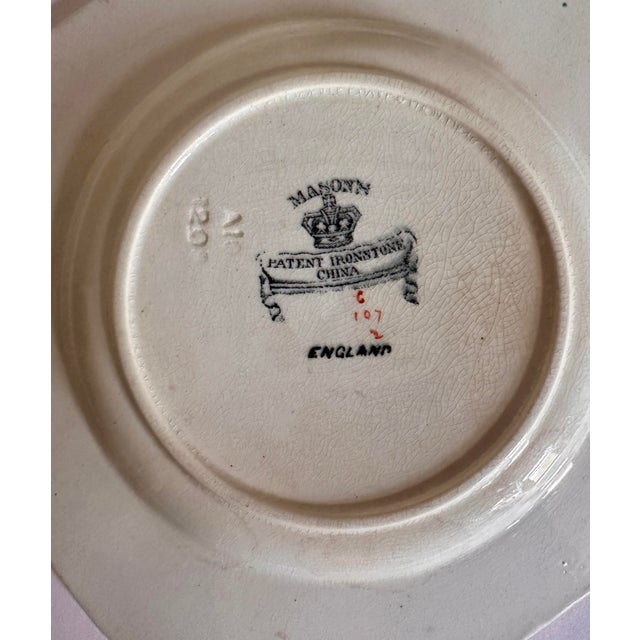 An antique Mason's Ironstone chinoiserie compote bowl featuring a decorative garden scene with a patterned border. It may...