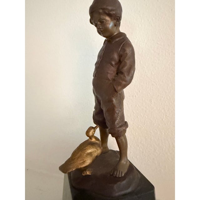 Charming bronze sculpture by late 19th century German sculptor Julius Paul Schmidt-Felling of a barefoot boy with his...