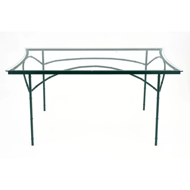 French vintage garden dining room table attributed to Maison Jansen. The structure is stylized bambou steel frame in a...