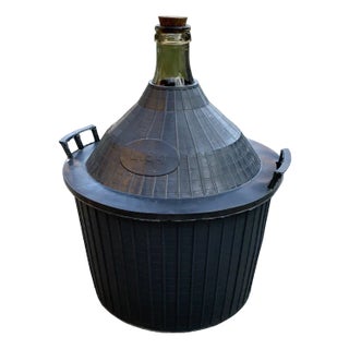 Mid-Century Glass Demijohn in Plastic Basket For Sale