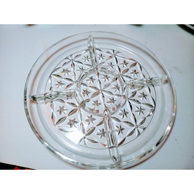 This is a very nice lead crystal plate with four dividers and a circle in the middle to hold a bowl of dip or a cheese...