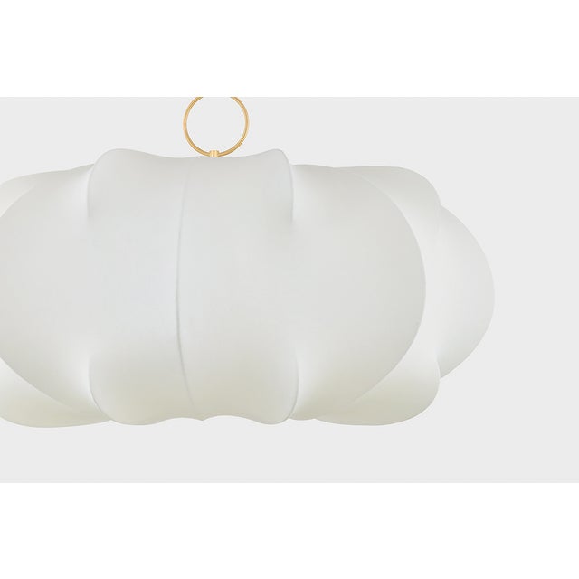 Light and voluminous, the Keilah pendant floats above a space like a cloud. The polymer shade features staggered ribs that...