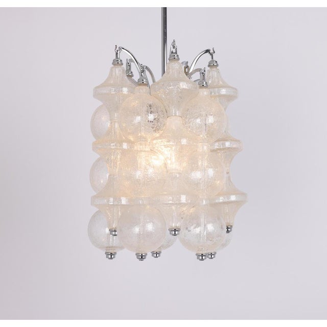 Wonderful onion-shaped -tulipan glass pendant light. Several hand-blown glasses are suspended on a white-painted metal...