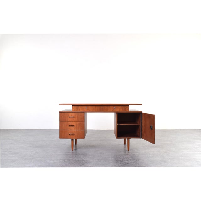 This teak desk was manufactured in Poland in the 1960s and it is an example of post-war design, clearly inspired by...