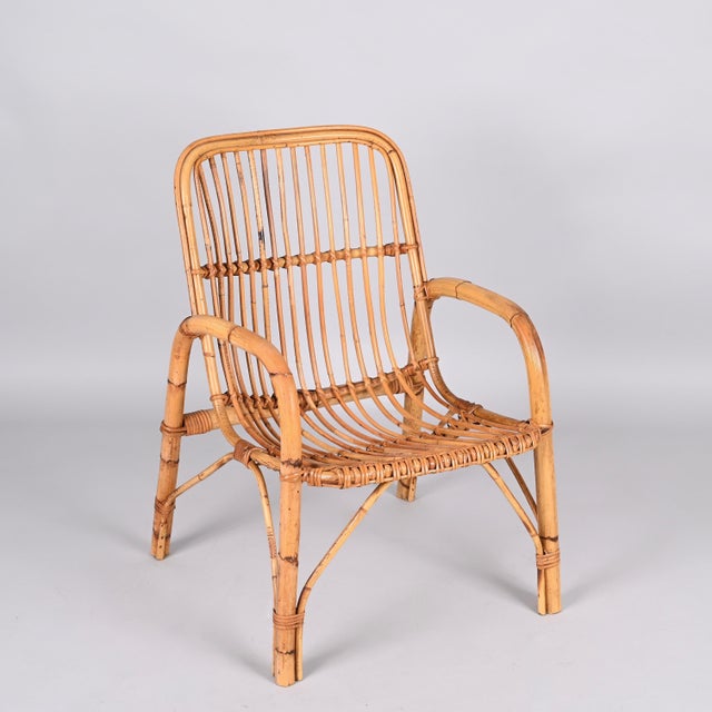 Midcentury rattan and bamboo Italian armchair. This item was produced in Italy during 1960s. The seat is made of thin...