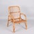 Midcentury rattan and bamboo Italian armchair. This item was produced in Italy during 1960s. The seat is made of thin...