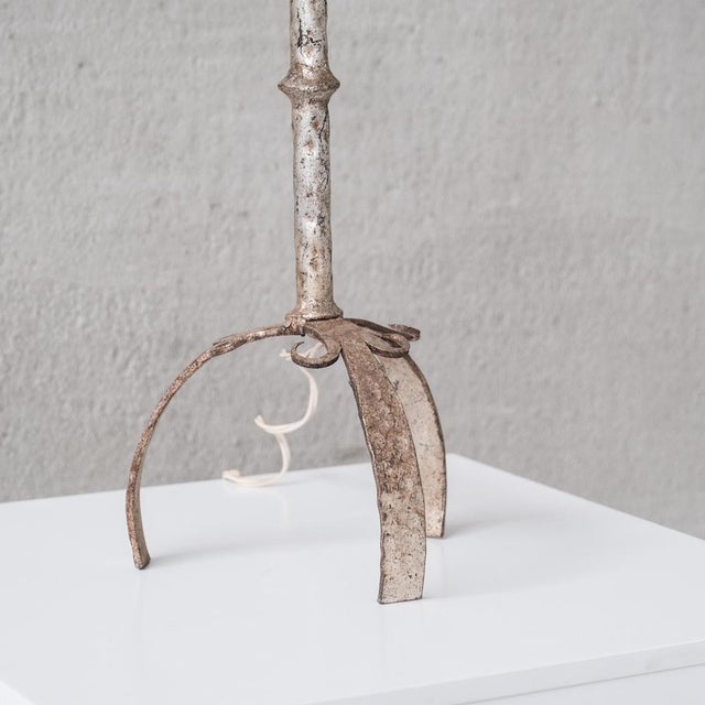 A single metal table lamp, on splayed feet, in a pleasing silvered colour. spain, c1960s. good vintage condition. the...