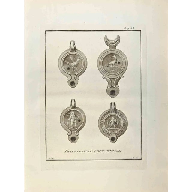 Oil Lamps with Cupid and Animals from "Antiquities of Herculaneum" is an etching on paper realized by Ferdinando Campana...